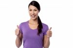 Smiling Woman With Thumbs Up Gesture Stock Photo