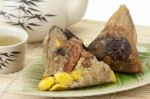 Rice Dumplings Or Zongzi With Tea Stock Photo