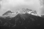 View Of Jade Dragon Snow Mountain With Cloudy In Lijiang ,china Stock Photo