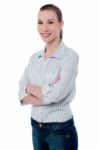 Confident Businesswoman With Folded Arms Stock Photo