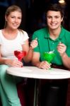 Happy Couple Enjoying Tempting Dessert Stock Photo