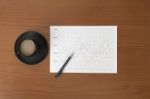 Offee On Worktable Covered With Documents Close Up Stock Photo