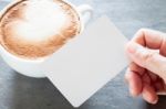 Coffee Cup With Name Card On Grey Background Stock Photo