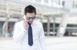 Asia Business Man Using A Mobile Phone Stock Photo