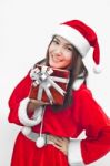 Santa Claus Hat With Red Christmas Gift Box Stock Photo