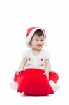 Happy Christmas Girl Sitting And Smiling Stock Photo