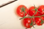 Fresh Cherry Tomatoes On A Cluster Stock Photo