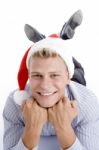 Happy Laying Man With Christmas Hat Stock Photo