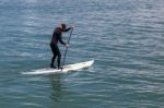 Paddling Surf Board Out Of Sausalito Marina Stock Photo