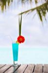 Blue Lagoon Cocktail On The Table At Tropical Beach Stock Photo