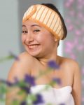 Smiling Woman In Her Bedroom Getting Dressed Stock Photo