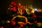 Two Glasses Of Champagne With A Christmas Decor In The Background Stock Photo