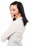 Smiling Young Call Center Executive Stock Photo