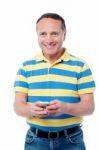 Casual Man Using  Mobile Phone Stock Photo