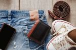 Jeans And Dress On Wooden Stock Photo