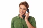 Smart Guy Answering Phone Call Stock Photo