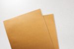 Brown Paper Envelope On Concrete Grunge Background Stock Photo