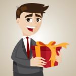 Cartoon Businessman With Gift Box Stock Photo