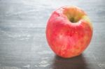 Red Apple On The Table Stock Photo