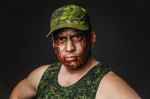 Military Style Camouflage On The Soldier's Face Stock Photo