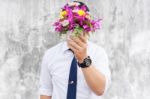 Waiting For His Girlfriend. Close Up Of Handsome Young Man Holdi Stock Photo