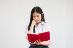 Asia Thai High School Student Uniform Beautiful Girl Read A Book Stock Photo