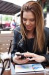 Young Woman Enjoying At Cafe Stock Photo