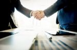 Businessmen Shaking Hands During A Meeting Stock Photo