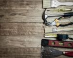 Set Of Tools Over A Wood Background Stock Photo