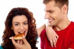 Smiling Young Couple Eating Pizza Stock Photo