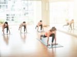 Asian Woman Doing Yoga Indoors Stock Photo