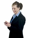 Businesswoman Reading Message On Her Mobile Stock Photo