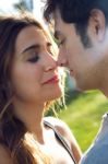 Outdoor Portrait Of Young Caucasian Couple At The Park Stock Photo