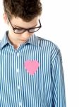 Pink paper heart shape in boy shirt Stock Photo