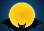 Halloween Flying Bat And Moon Stock Photo