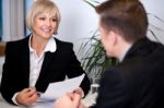 Businesswoman Working With Her Colleagues Stock Photo