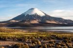 Snow Capped Parinacota Volcano Reflected In Lake Chungara, Chile Stock Photo