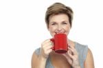 Young Woman Enjoying Her Coffee Stock Photo