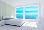 White Modern Loft Bedroom Interior With Sea View Stock Photo