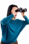 Side Pose Of Female Looking Through Binocular On White Background Stock Photo