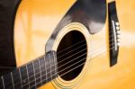 Wooden Yellow Classic Acoustic Guitar Stock Photo