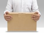 Man Carrying Cardboard Box Stock Photo