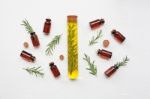 Glass Bottle Of Essential Oil  With Rosemary Stock Photo