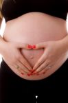 Pregnant Woman Shows Heart Symbol Stock Photo