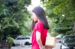 Portrait Of Thai Teen Beautiful Girl In Chinese Dress, Happy New Year And Open Box Gift, Smile And Very Happy Stock Photo