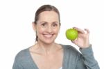 Health Conscious Woman Holding Fresh Green Apple Stock Photo