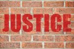 Old Brick Wall Texture With Justice Inscription Stock Photo