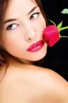 Red Rose Near Lips And Naked Shoulder Stock Photo