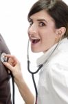 Surprising Doctor With Stethoscope Stock Photo