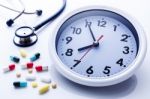 Clock With Medicine Stock Photo